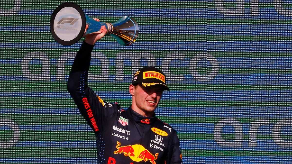 Formula One F1 - United States Grand Prix - Circuit of the Americas, Austin, Texas, U.S. - October 24, 2021 Red Bull's Max Verstappen celebrates on the podium with the trophy after winning the race REUTERS/Brian Snyder