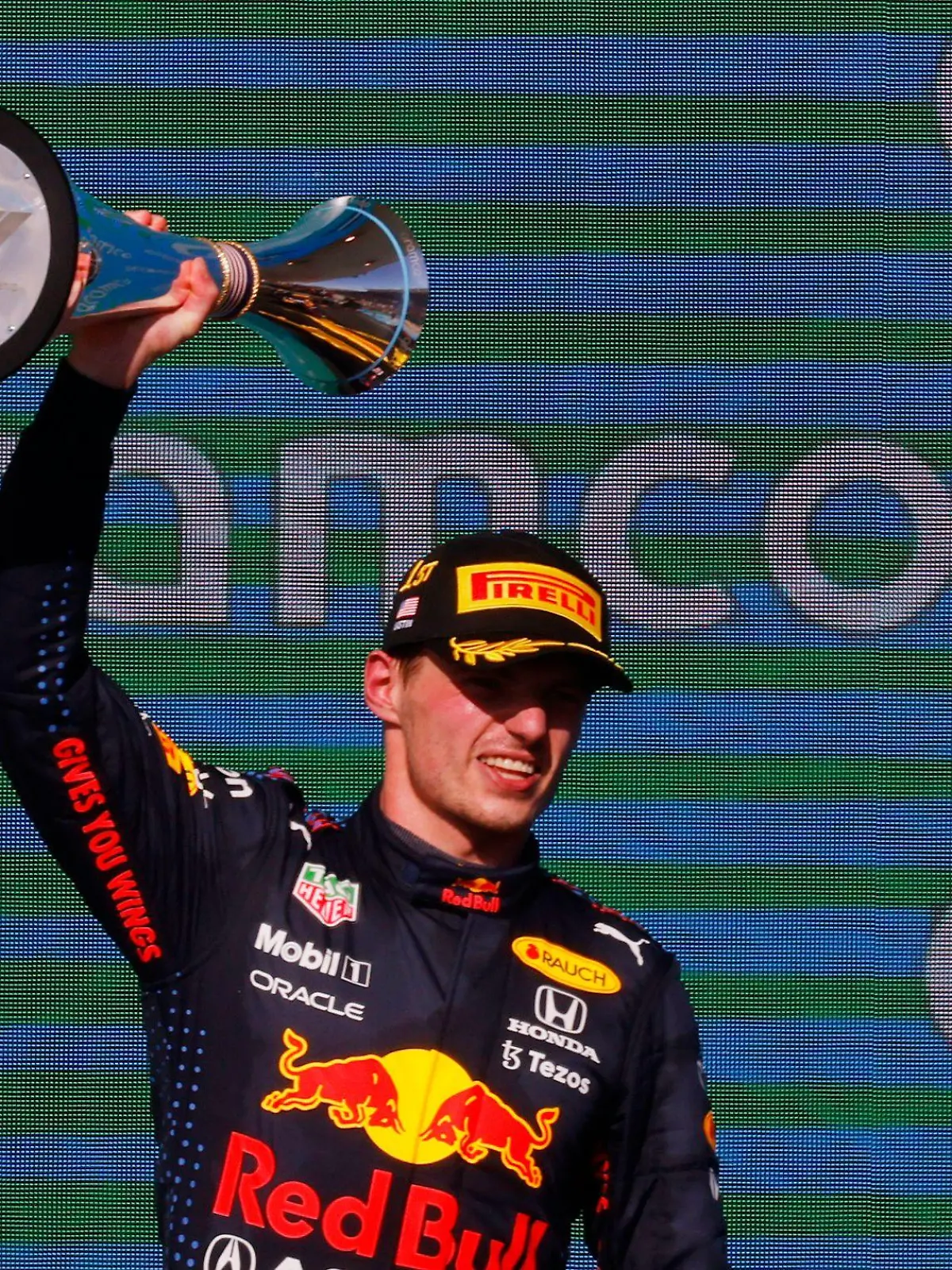 Formula One F1 - United States Grand Prix - Circuit of the Americas, Austin, Texas, U.S. - October 24, 2021 Red Bull's Max Verstappen celebrates on the podium with the trophy after winning the race REUTERS/Brian Snyder