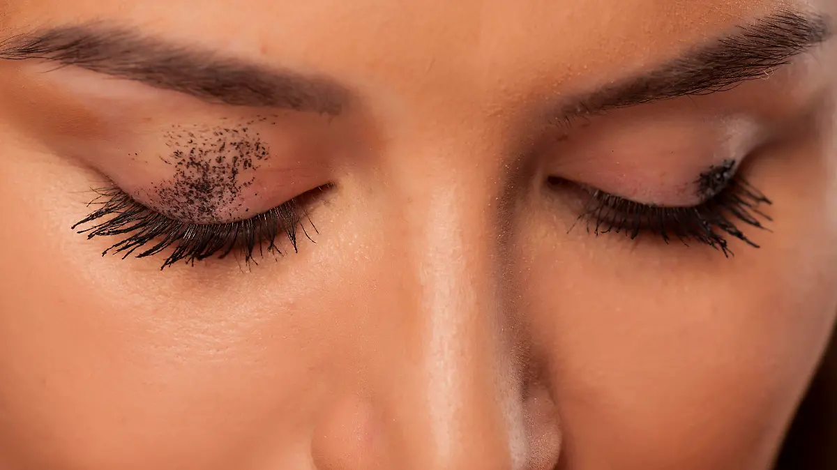 Mascara smudged on the eyelid. Make up concept
