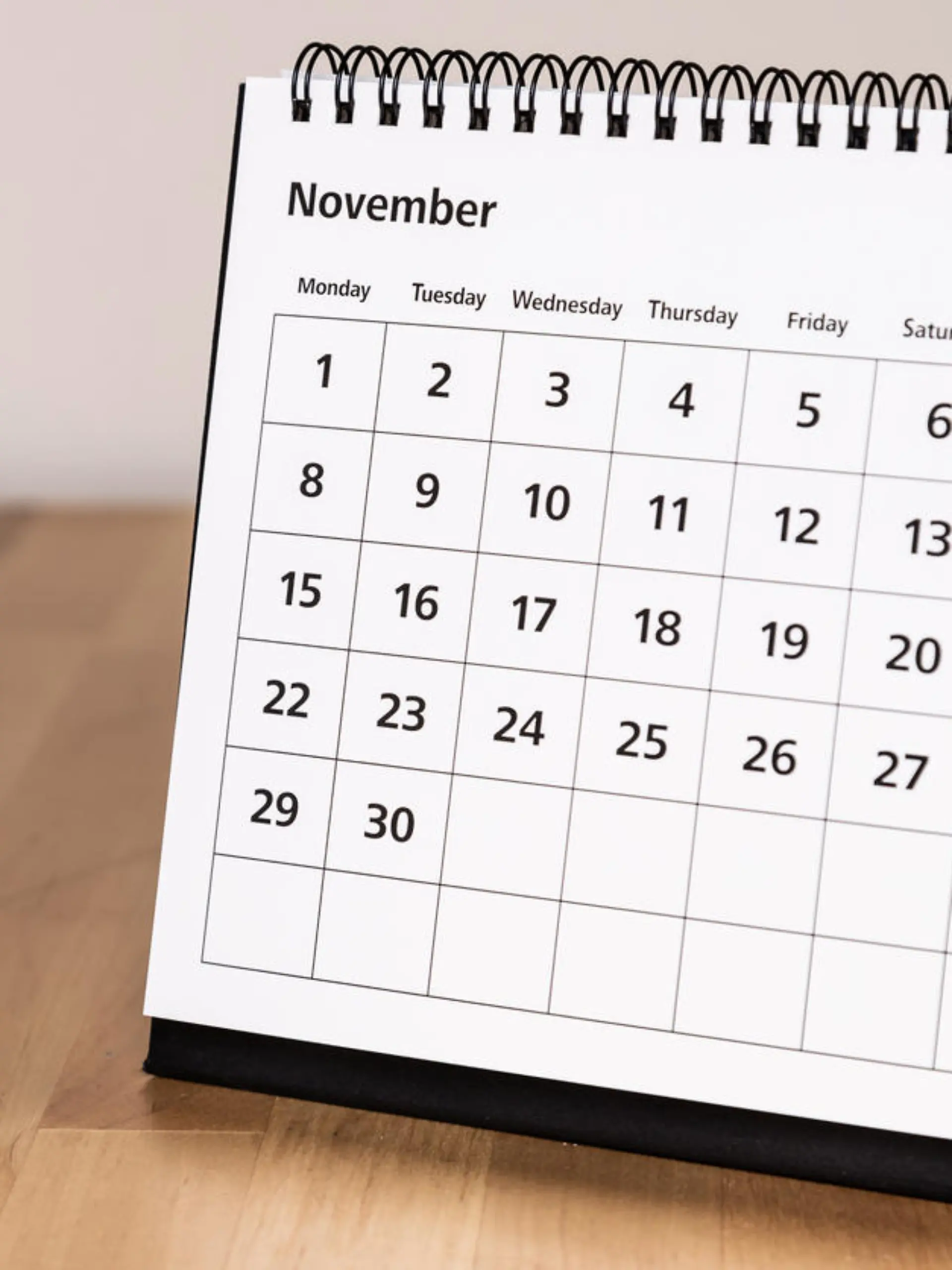 Month page: November in 2021 paper calendar on the wooden table