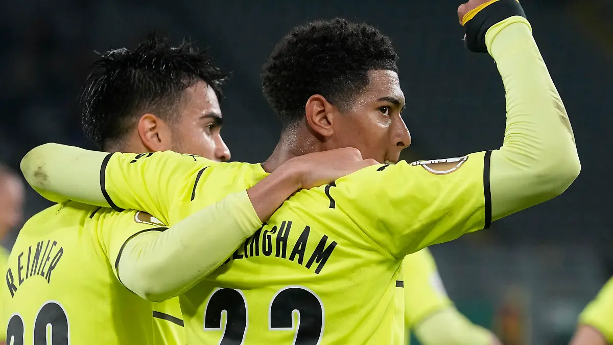 Dortmund's Reinier, left, and Dortmund's Jude Bellingham celebrate after Dortmund's Thorgan Hazard scored his side's opening goal during the German Soccer Cup match between Borussia Dortmund and FC Ingolstadt 04 in Dortmund, Germany, Tuesday, Oct. 26, 2021. (AP Photo/Martin Meissner)