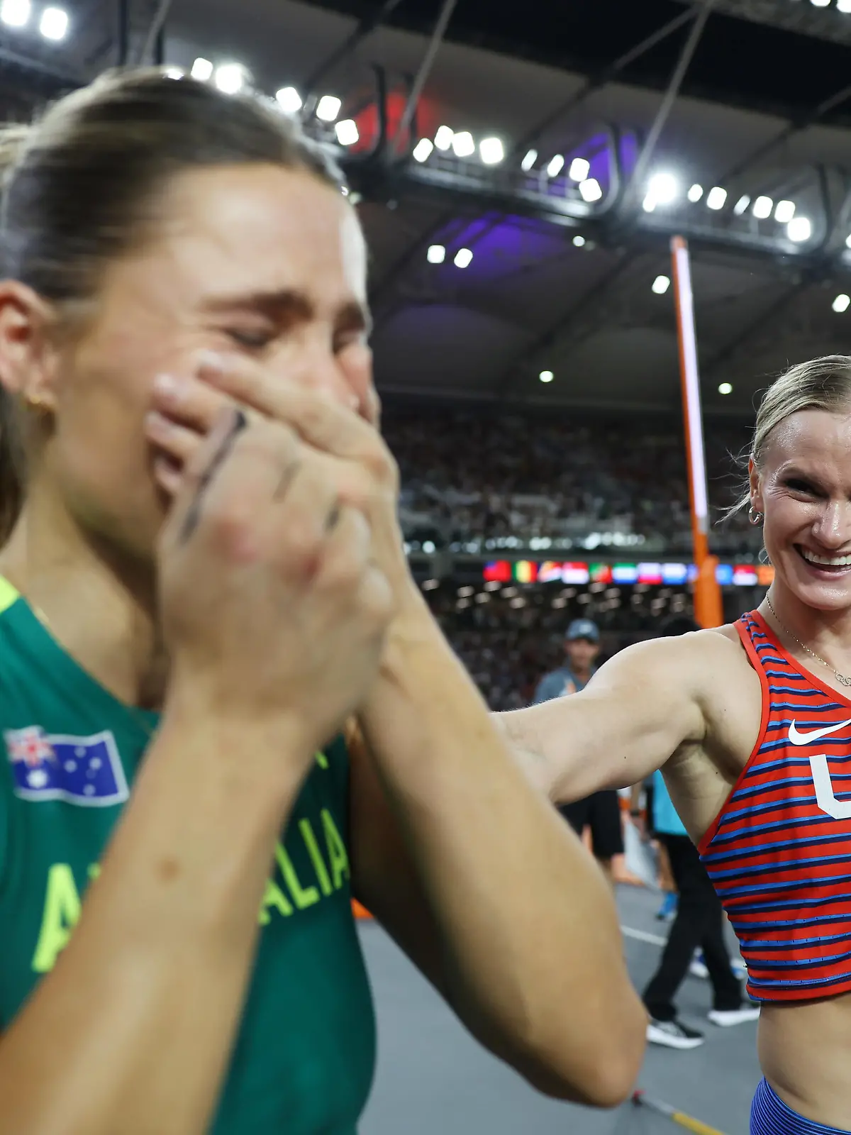BUDAPEST, HUNGARY - AUGUST 23: Nina Kennedy of Team Australia and Katie Moon of Team United States react after competing in the Women's Pole Vault Final during day five of the World Athletics Championships Budapest 2023 at National Athletics Centre on August 23, 2023 in Budapest, Hungary. Kennedy and Moon decided to share the gold medal. (Photo by Steph Chambers/Getty Images)