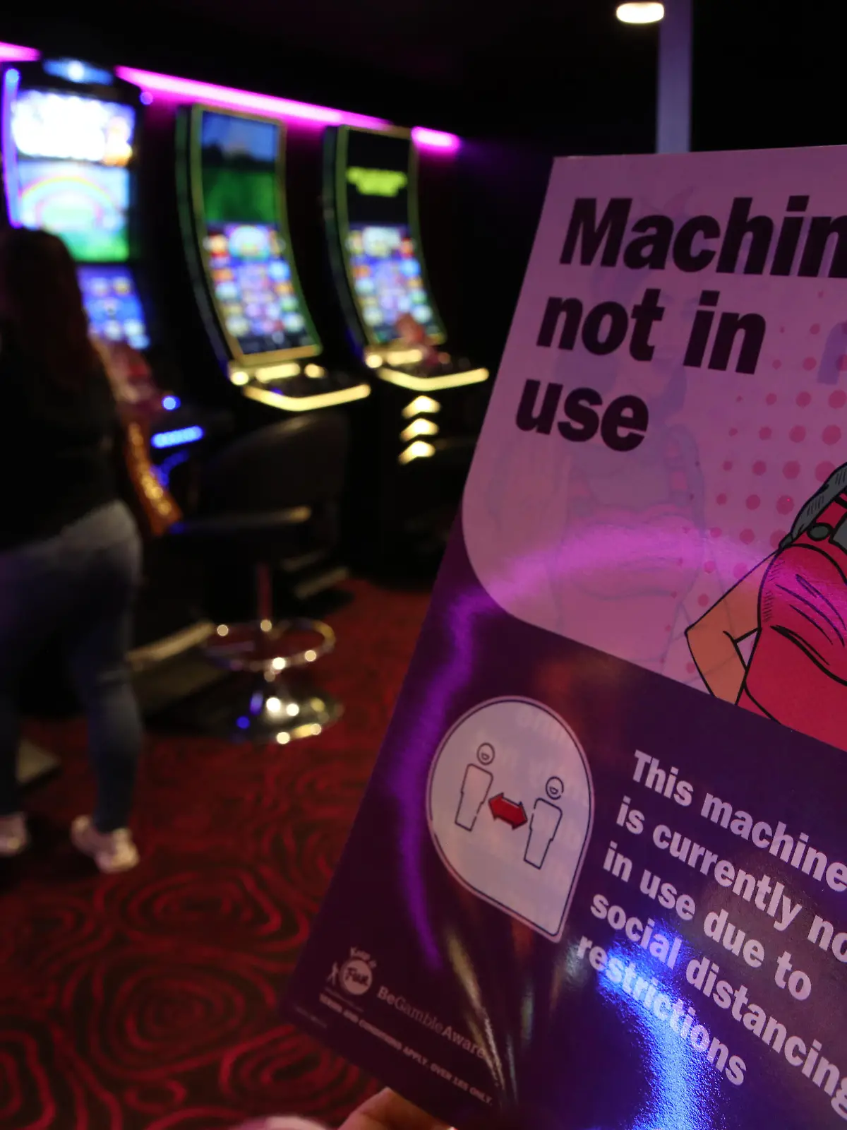 Coronavirus - Mon Aug 24, 2020. Signs on slot machines at MECCA Bingo in Glasgow, as Scotland continues with the gradual lifting of restrictions for bowling alleys, bingo halls and casinos to ease out of lockdown. Picture date: Monday August 24, 2020. See PA story HEALTH Coronavirus. Photo credit should read: Andrew Milligan/PA Wire URN:55143306