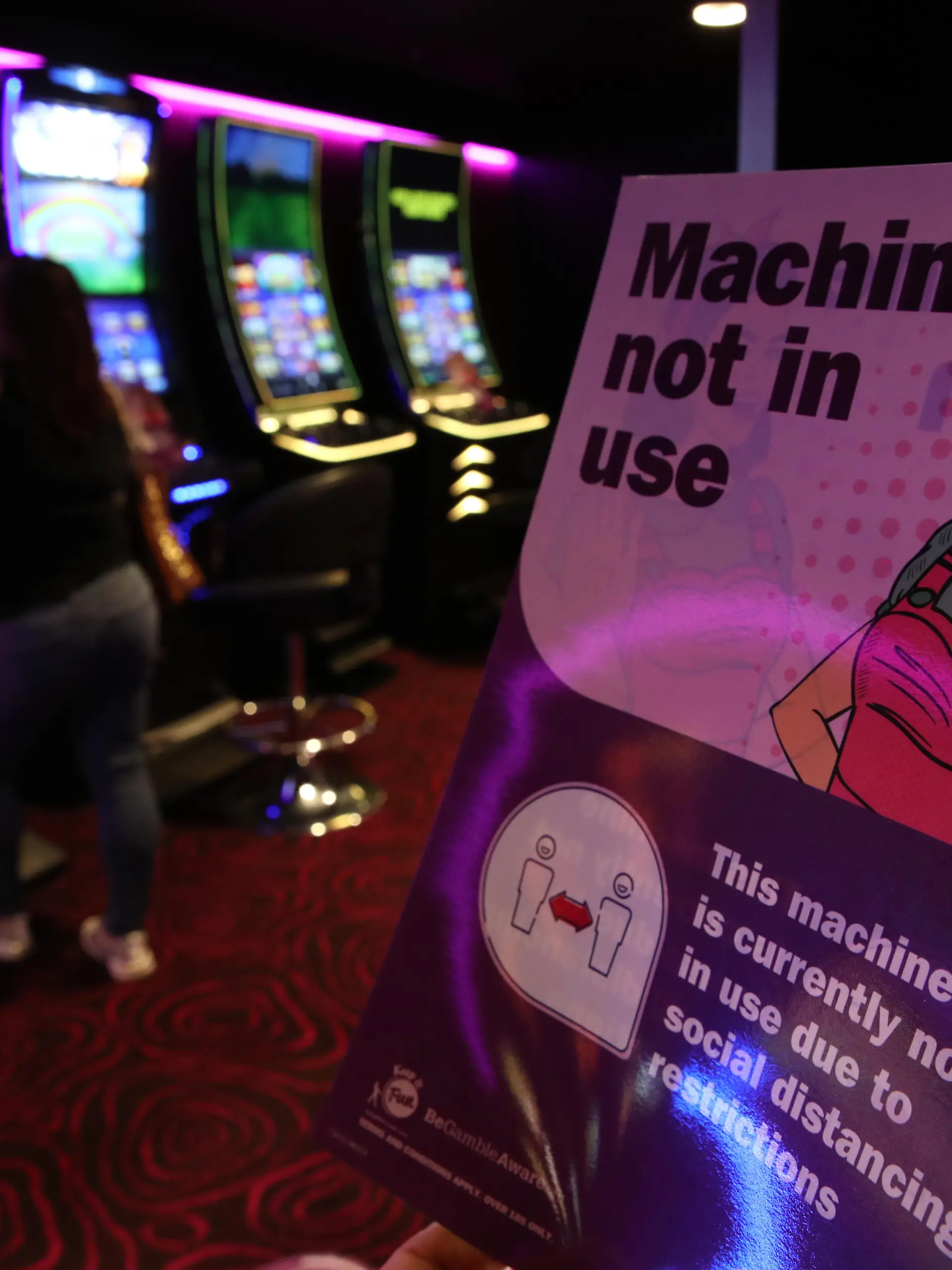 Coronavirus - Mon Aug 24, 2020. Signs on slot machines at MECCA Bingo in Glasgow, as Scotland continues with the gradual lifting of restrictions for bowling alleys, bingo halls and casinos to ease out of lockdown. Picture date: Monday August 24, 2020. See PA story HEALTH Coronavirus. Photo credit should read: Andrew Milligan/PA Wire URN:55143306