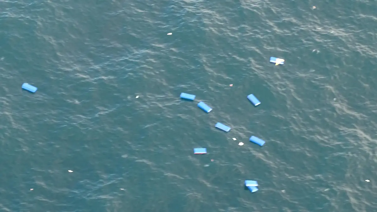 Containers which fell overboard from the ship Zim Kingston are seen floating west of the Straits of Juan de Fuca, off the west coast of British Columbia, Canada and Washington state, U.S. are seen in an image taken by a U.S. Coast Guard Air Station Port Angeles helicopter October 22, 2021. Picture taken October 22, 2021.  U.S. Coast Guard/Handout via REUTERS.   THIS IMAGE HAS BEEN SUPPLIED BY A THIRD PARTY.