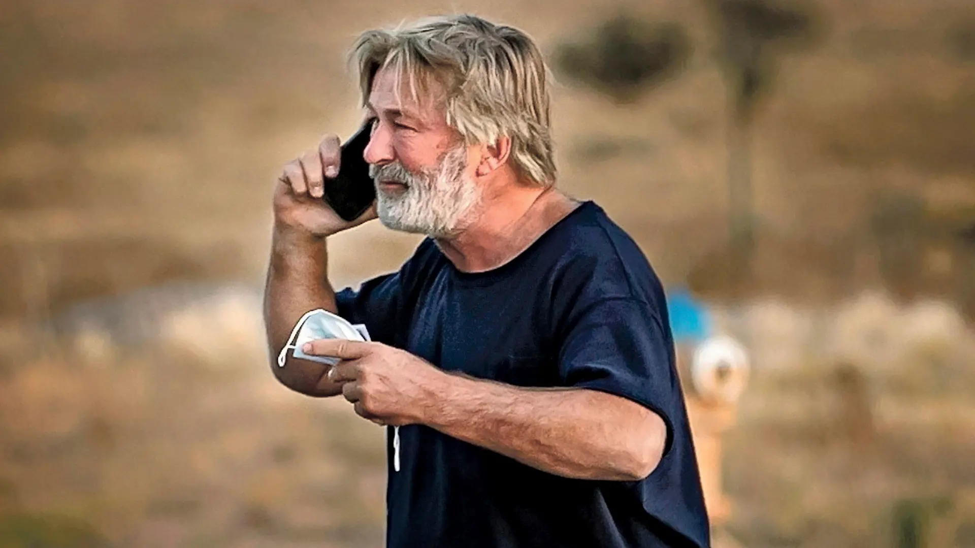 Alec Baldwin speaks on the phone in the parking lot outside the Santa Fe County Sheriff's Office in Santa Fe, N.M., after he was questioned about a shooting on the set of the film "Rust" on the outskirts of Santa Fe, Thursday, Oct. 21, 2021. Baldwin fired a prop gun on the set, killing cinematographer Halyna Hutchins and wounding director Joel Souza, officials said. (Jim Weber/Santa Fe New Mexican via AP)