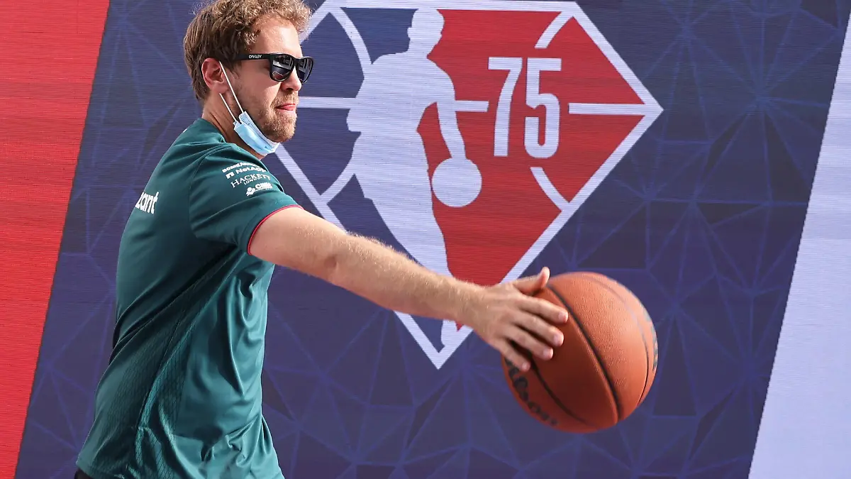 Formula One F1 - United States Grand Prix - Circuit of the Americas, Austin, Texas, U.S. - October 21, 2021 Aston Martin's Sebastian Vettel plays basketball in the paddock ahead of the Grand Prix REUTERS/Mike Blake