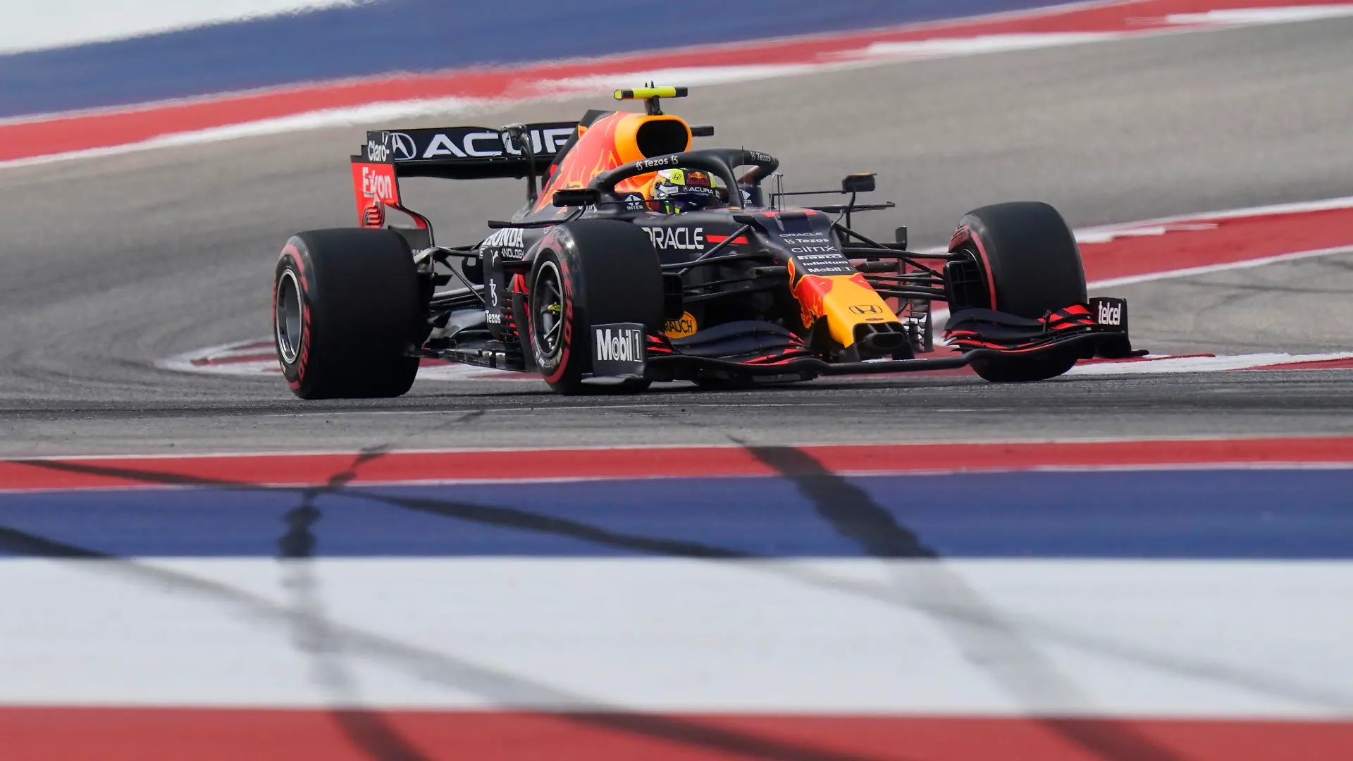 Red Bull driver Sergio Perez, of Mexico, steers through a turn during an open practice for the Formula One U.S. Grand Prix auto race at the Circuit of the Americas, Friday, Oct. 22, 2021, in Austin, Texas. (AP Photo/Eric Gay)