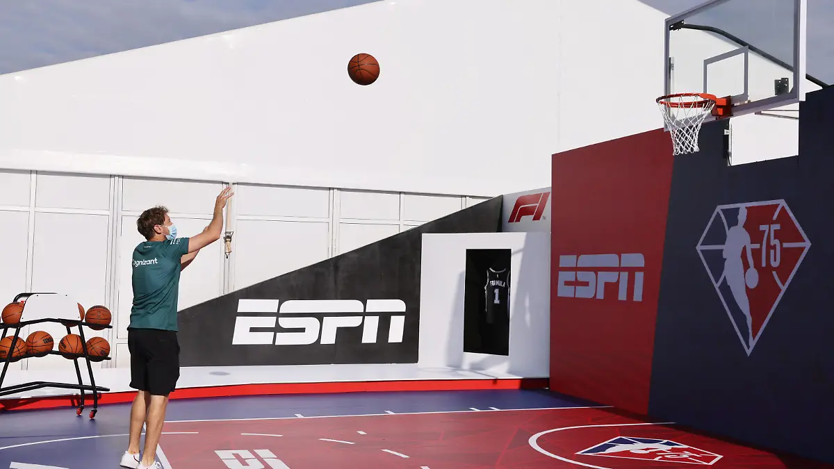 Formula One F1 - United States Grand Prix - Circuit of the Americas, Austin, Texas, U.S. - October 21, 2021 Aston Martin's Sebastian Vettel plays basketball in the paddock ahead of the Grand Prix REUTERS/Mike Blake