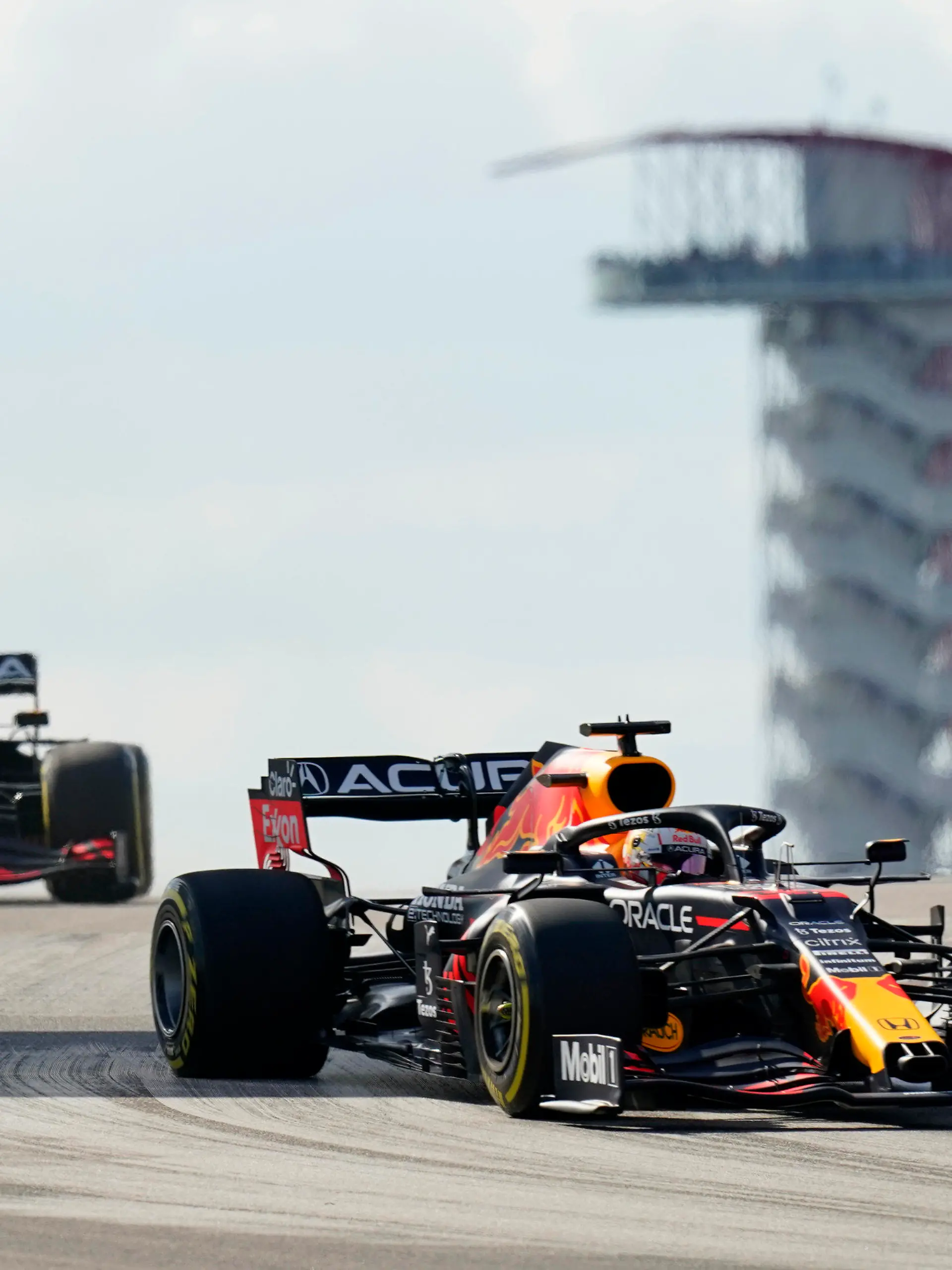 Red Bull driver Max Verstappen, of the Netherlands, right, and Red Bull driver Sergio Perez, of Mexico, left, steer through a turn during an open practice for the Formula One U.S. Grand Prix auto race at Circuit of the Americas, Friday, Oct. 22, 2021, in Austin, Texas. (AP Photo/Eric Gay)