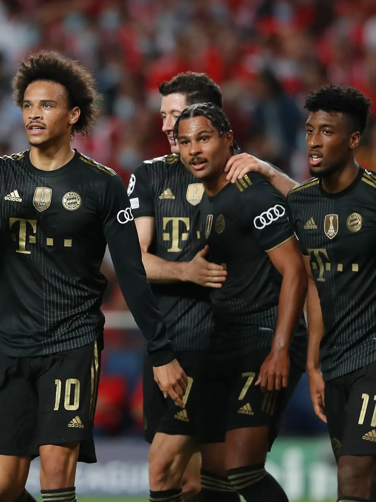 Soccer Football - Champions League - Group E - Benfica v Bayern Munich - Estadio da Luz, Lisbon, Portugal - October 20, 2021  Bayern Munich's Leroy Sane celebrates scoring their fourth goal with Serge Gnabry , Robert Lewandowski and Kingsley Coman REUTERS/Pedro Nunes
