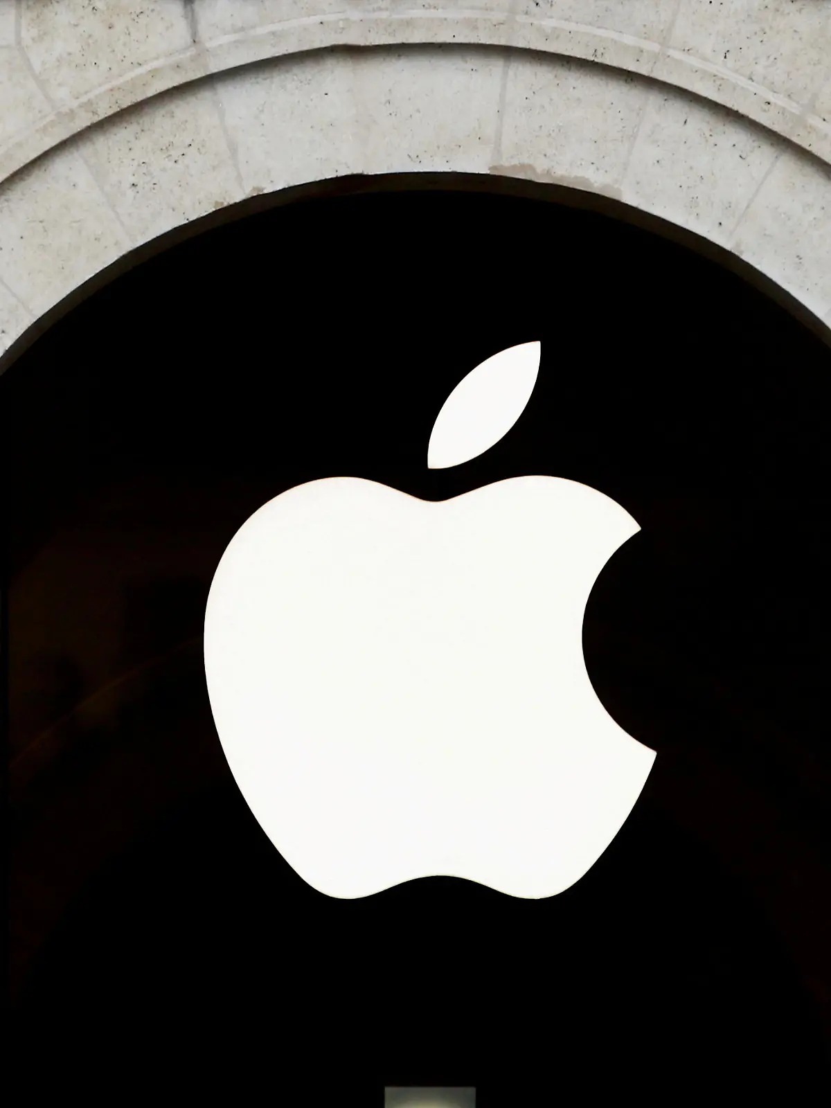FILE PHOTO: Apple logo is seen on the Apple store at The Marche Saint Germain in Paris, France July 15, 2020.  REUTERS/Gonzalo Fuentes/File Photo