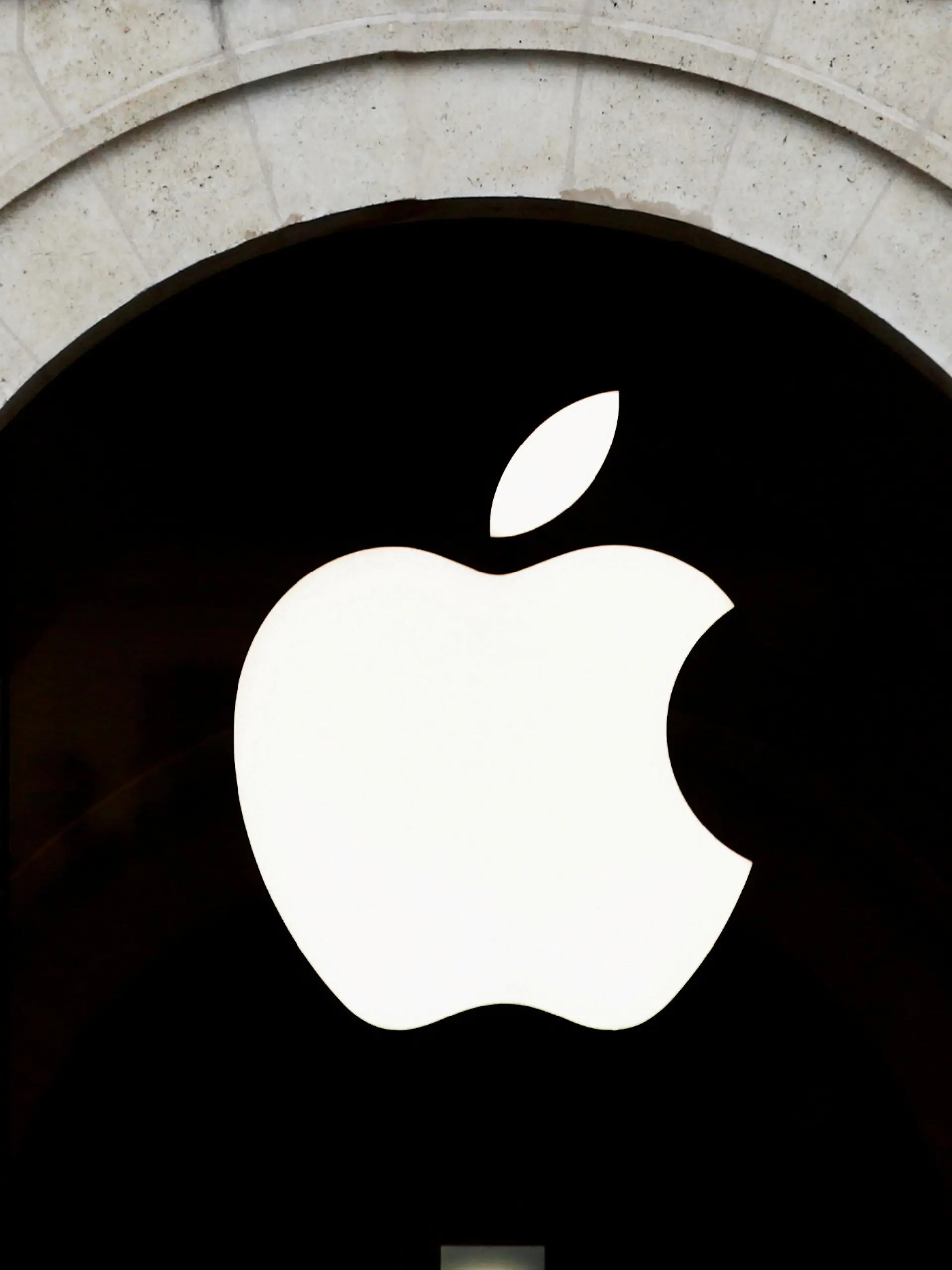 FILE PHOTO: Apple logo is seen on the Apple store at The Marche Saint Germain in Paris, France July 15, 2020.  REUTERS/Gonzalo Fuentes/File Photo