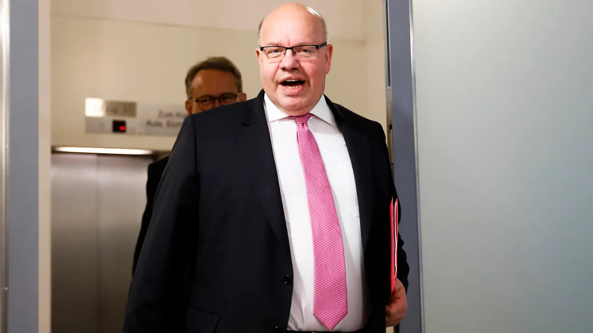 German Economy Minister Peter Altmaier, foreground, and State Secretary at the economy ministry Ulrich Nussbaum arrive for a news conference about a so called 'stabilization package' for German airline Lufthansa at the economy ministry in Berlin, Germany, Monday, May 25, 2020. (AP Photo/Markus Schreiber, Pool)