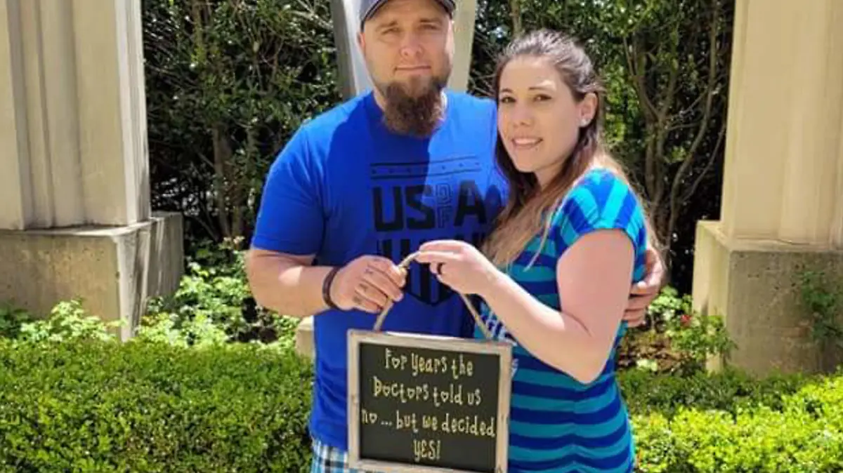MERCURY PRESS (Pictured: Chad, 38, and wife Missy Dippner, 25, annocing she is pregnat, Pennsylvania, US. ) - A menopausal woman is expecting her first child despite one per cent odds. Missy Dippner, 25, believed she may never become a mum after starting menopause at just 17 years old. The homemaker was diagnosed with premature ovarian failure meaning her ovaries had stopped working. But in April this year, a miracle happened as Missy, from Pennsylvania, US, went to the emergency room with a suspected water infection but blood tests revealed she was pregnant. - SEE MERCURY COPY