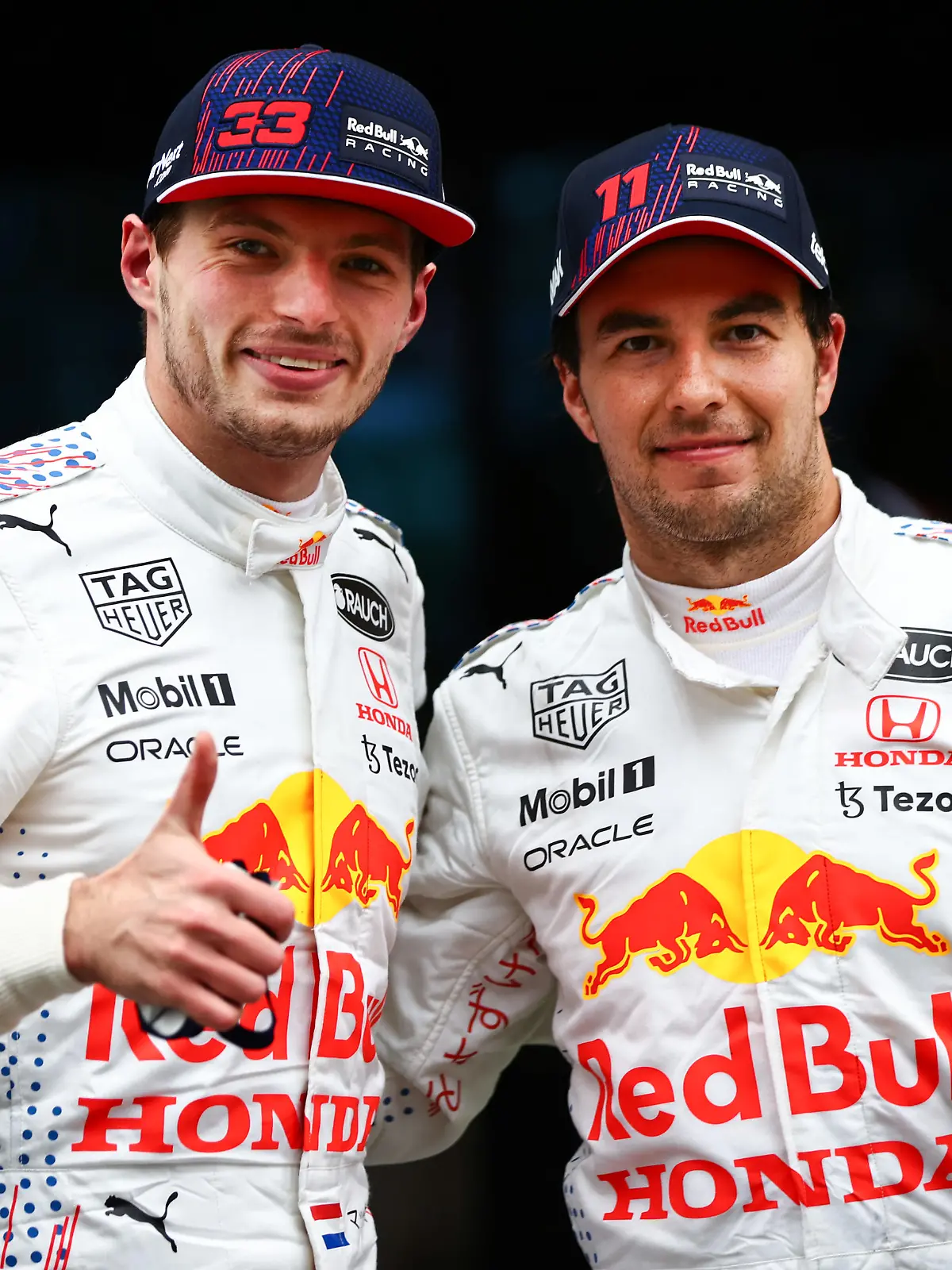 ISTANBUL, TURKEY - OCTOBER 10: Second placed Max Verstappen of Netherlands and Red Bull Racing and third placed Sergio Perez of Mexico and Red Bull Racing celebrate in parc ferme during the F1 Grand Prix of Turkey at Intercity Istanbul Park on October 10, 2021 in Istanbul, Turkey. (Photo by Mark Thompson/Getty Images)