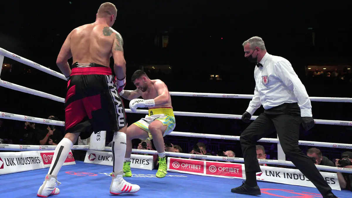 211017 -- LATVIA, Oct. 17, 2021 -- Mairis Briedis L of Latvia knocks down Artur Mann C of Germany during the cruiserweight IBF World Champion title boxing match at the Arena Riga, in Riga, Latvia, Oct. 16, 2021. Photo by /Xinhua SPLATVIA-RIGA-BOXING-IBF-CRUISERWEIGHT TITLE FIGHT EdijsxPalens PUBLICATIONxNOTxINxCHN