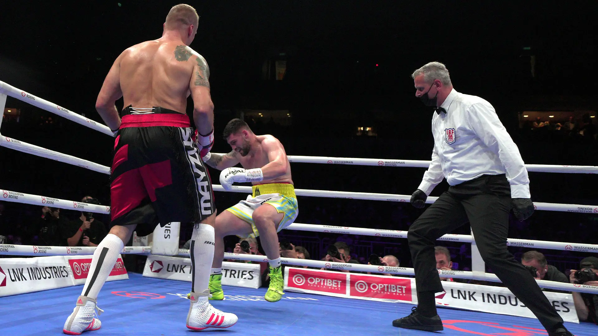 211017 -- LATVIA, Oct. 17, 2021 -- Mairis Briedis L of Latvia knocks down Artur Mann C of Germany during the cruiserweight IBF World Champion title boxing match at the Arena Riga, in Riga, Latvia, Oct. 16, 2021. Photo by /Xinhua SPLATVIA-RIGA-BOXING-IBF-CRUISERWEIGHT TITLE FIGHT EdijsxPalens PUBLICATIONxNOTxINxCHN