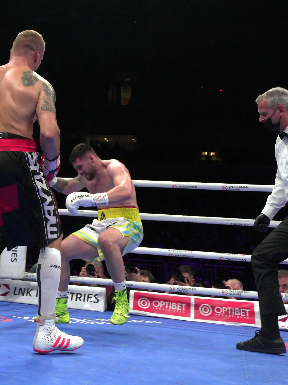  211017 -- LATVIA, Oct. 17, 2021 -- Mairis Briedis L of Latvia knocks down Artur Mann C of Germany during the cruiserweight IBF World Champion title boxing match at the Arena Riga, in Riga, Latvia, Oct. 16, 2021. Photo by /Xinhua SPLATVIA-RIGA-BOXING-IBF-CRUISERWEIGHT TITLE FIGHT EdijsxPalens PUBLICATIONxNOTxINxCHN