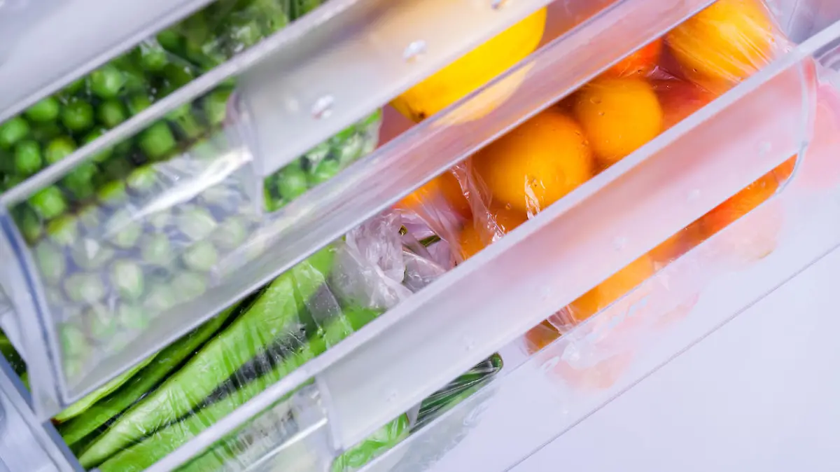 Four drawer freezer, full of fruit and vegetables in studio shot