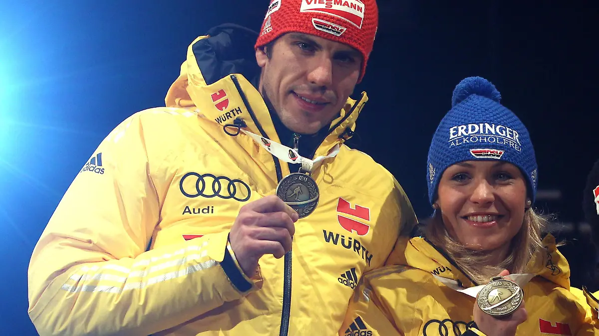 RUHPOLDING, GERMANY - MARCH 01: Arnd Peiffer (L) of Germany celebrates winning the Bronce medal with his team mates Magdalena Neuner (2nd L), Andrea Henkel (2nd R) and Andreas Birnbacher at the medal ceremony for the IBU Biathlon World Championships Mixed Relay on March 1, 2012 in Ruhpolding, Germany. (Photo by Alexander Hassenstein/Bongarts/Getty Images)