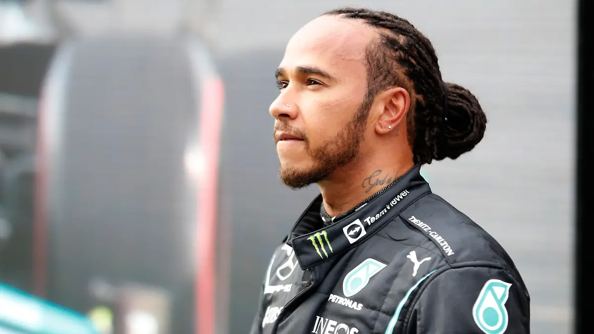 Mercedes driver Lewis Hamilton of Britain, reacts to the crowds after the end of qualifying for Sunday's Formula One Turkish Grand Prix at the Intercity Istanbul Park circuit in Istanbul, Turkey, Saturday, Oct. 9, 2021. Hamilton who took pole position will start 10th due to a penalty with Mercedes driver Valtteri Bottas of Finland who came second promoted to pole. (Umit Bektas/Pool Photo via AP)