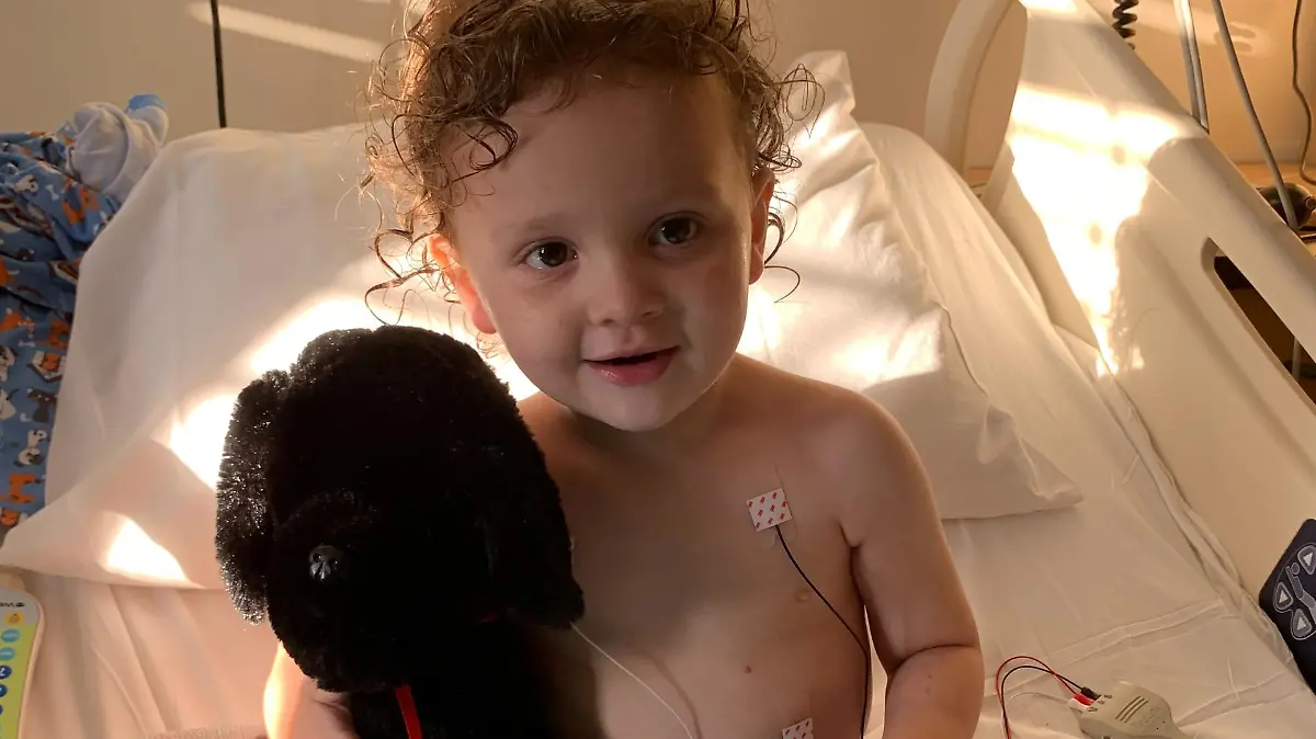 Adrian James, 2, sits up in a bed after spending more than a week on a ventilator in the intensive care unit at Cardinal Glennon Children's Hospital in St. Louis for a severe case of COVID-19, in Missouri, U.S., October 11, 2021. Tiffany Jackson/Handout via REUTERS. THIS IMAGE HAS BEEN SUPPLIED BY A THIRD PARTY. NO RESALES. NO ARCHIVES
