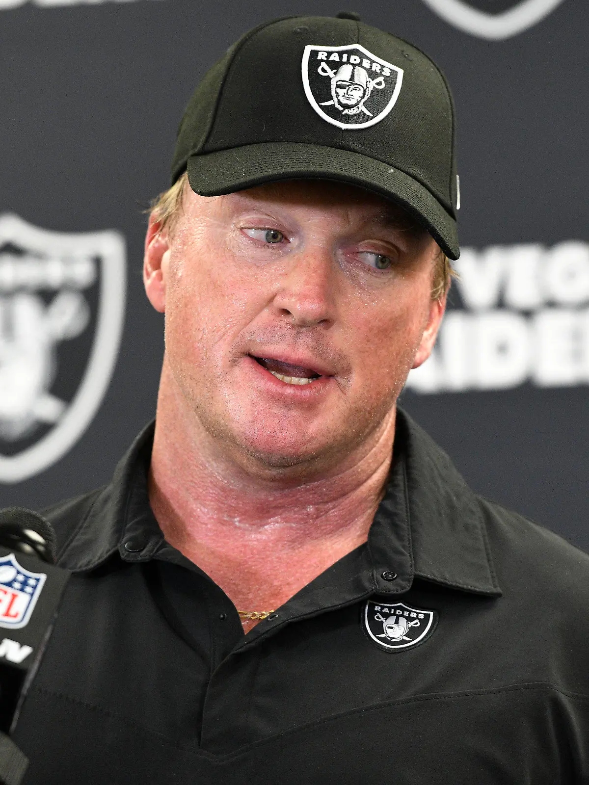 FILE - In this Sept. 19, 2021, file photo, Las Vegas Raiders head coach Jon Gruden meets with the media following an NFL football game against the Pittsburgh Steelers in Pittsburgh. Gruden is out as coach of the Raiders after emails he sent before being hired in 2018 contained racist, homophobic and misogynistic comments. A person familiar with the decision said Gruden is stepping down after The New York Times reported that Gruden frequently used misogynistic and homophobic language directed at Commissioner Roger Goodell and others in the NFL. (AP Photo/Don Wright, File)