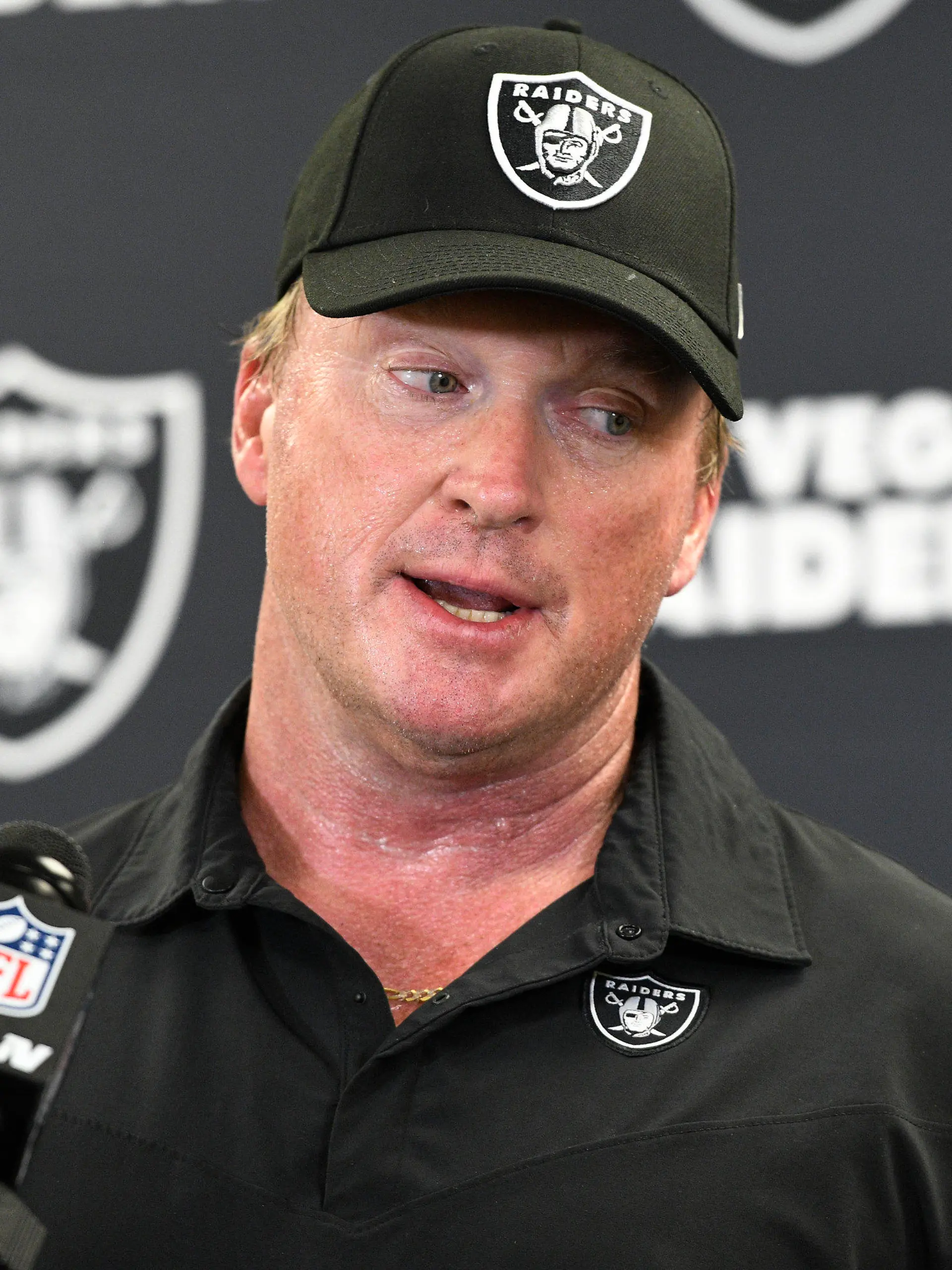 FILE - In this Sept. 19, 2021, file photo, Las Vegas Raiders head coach Jon Gruden meets with the media following an NFL football game against the Pittsburgh Steelers in Pittsburgh. Gruden is out as coach of the Raiders after emails he sent before being hired in 2018 contained racist, homophobic and misogynistic comments. A person familiar with the decision said Gruden is stepping down after The New York Times reported that Gruden frequently used misogynistic and homophobic language directed at Commissioner Roger Goodell and others in the NFL. (AP Photo/Don Wright, File)