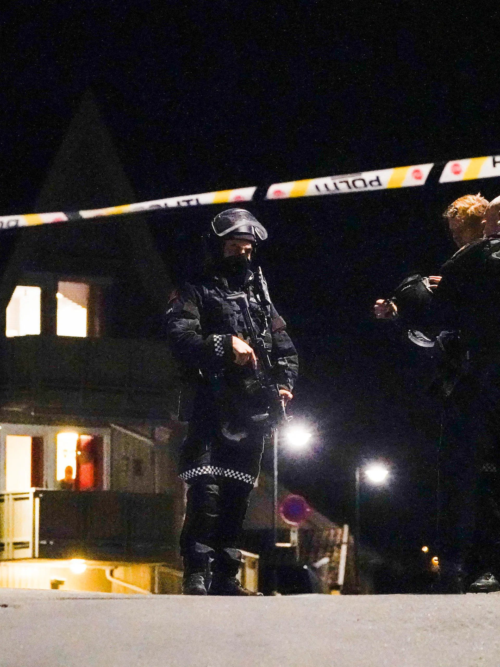 Police at the scene after an attack in Kongsberg, Norway, Wednesday, Oct. 13, 2021. Several people have been killed and others injured by a man armed with a bow and arrow in a town west of the Norwegian capital, Oslo. (Hakon Mosvold Larsen/NTB Scanpix via AP)
