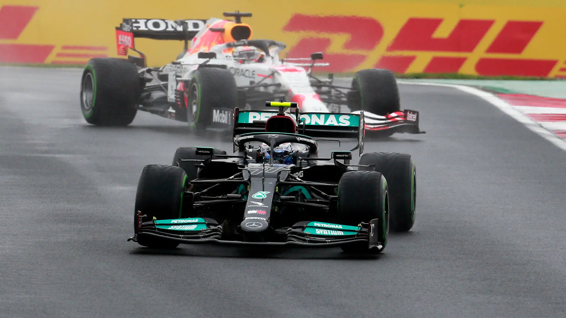 Mercedes driver Valtteri Bottas of Finland steers his car followed by Red Bull driver Max Verstappen of the Netherlands during the Turkish Formula One Grand Prix at the Intercity Istanbul Park circuit in Istanbul, Turkey, Sunday, Oct. 10, 2021. (AP Photo)