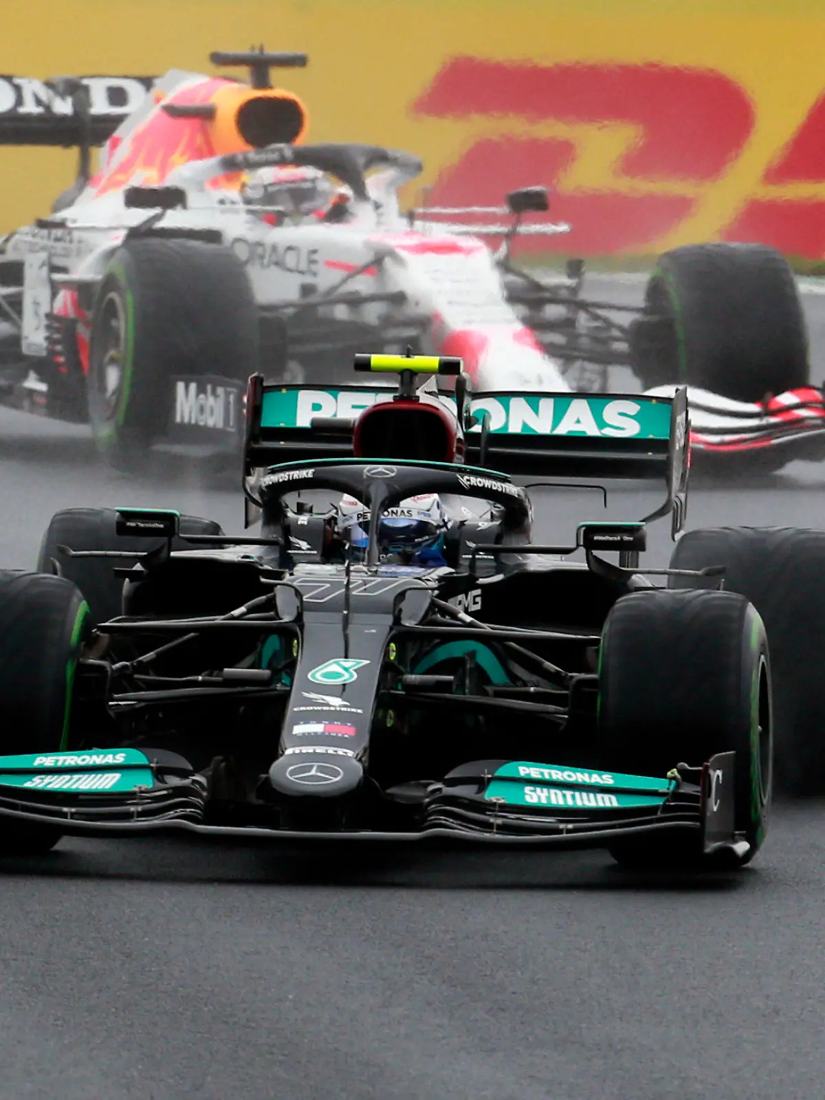 Mercedes driver Valtteri Bottas of Finland steers his car followed by Red Bull driver Max Verstappen of the Netherlands during the Turkish Formula One Grand Prix at the Intercity Istanbul Park circuit in Istanbul, Turkey, Sunday, Oct. 10, 2021. (AP Photo)