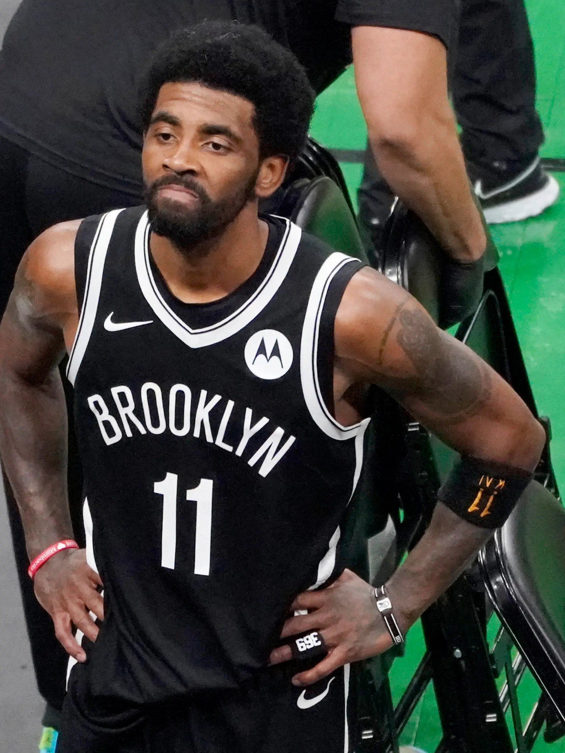 FILE - Brooklyn Nets guard Kyrie Irving looks up at the fans at TD Garden after they defeated the Boston Celtics in Game 4 during an NBA basketball first-round playoff series in Boston, in this Sunday, May 30, 2021, file photo. The Brooklyn Nets won't play Kyrie Irving until he can play in all their games, unwilling to let questions about his vaccination status linger into the season. The Nets announced Tuesday, Oct. 12, 2021, that Irving would not play or practice with them until he could be a full participant, ending the idea that he would play in only road games. Without mentioning his vaccination status, general manager Sean Marks said Irving has made a decision that keeps him from being able to perform with the team. (AP Photo/Elise Amendola, File)