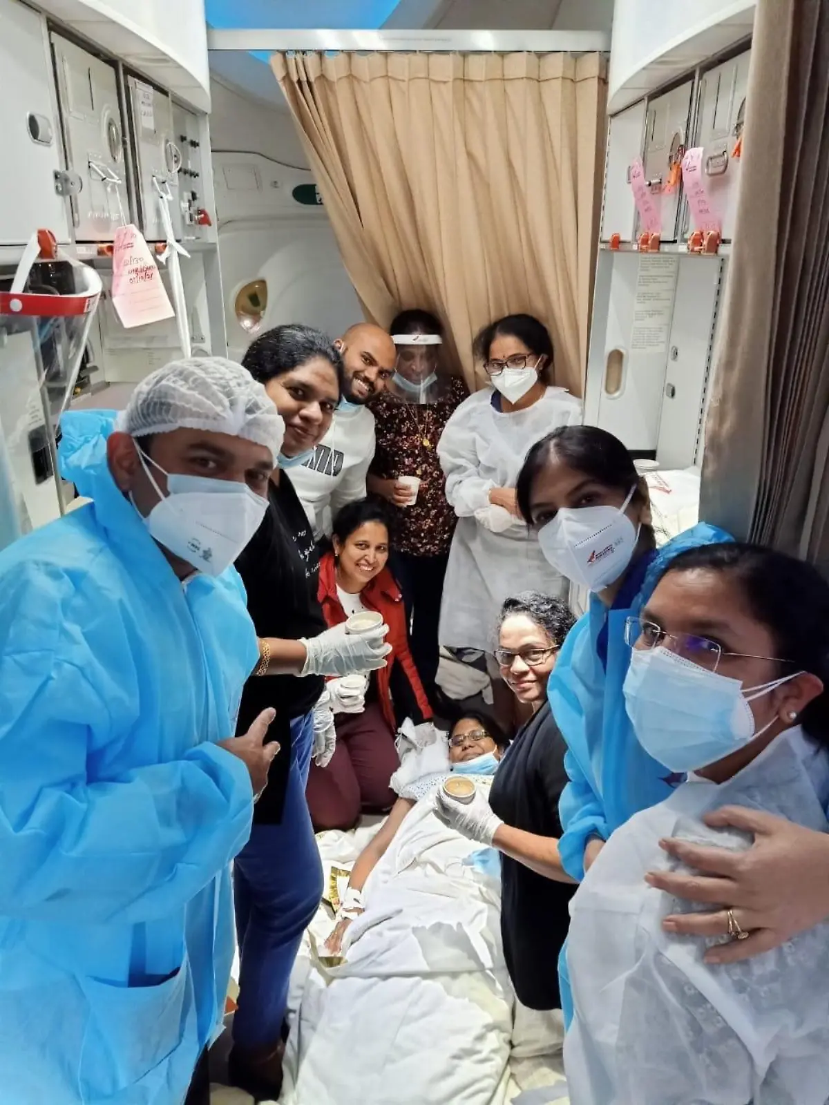 Story from Jam Press (Born In The Sky)

Pictured: Maria Phillip with the crew, doctors and nurses that helped deliver her baby.

Woman gives birth to baby boy while on London FLIGHT and TWO MONTHS EARLY

A woman has given birth to a baby boy on a flight from London to India after going into labour two months early.

Maria Philip, originally from Pathanamthitta, Kerala, India, was flying to Kochi from Heathrow on 5 October, but she started to experience pains shortly after takeoff.

The mum-to-be was seven months pregnant so wasn't expecting to welcome her baby until later this year.

When the Air India crew realised what was happening, they found two doctors and four nurses who were travelling on board to help.

With their assistance, the baby boy arrived safely, while the plane was still mid-air.

The plane then made an emergency landing at the nearest airport in Frankfurt, Germany, where mother and baby were met by medical staff and taken to hospital to be checked over.

Air India has vowed to fly them both home to India when they are well enough.

The flight continued the planned journey, landing in Kochi six hours behind schedule.

Air India said: "Kudos to our crew and special salute to doctors and medical staff on board for making this easy for the mother. 

"Our aircraft is well equipped with all necessary medical equipment and our crew are experienced to handle this kind of eventuality.

"Our officials are in constant touch with the family and all necessary support is being provided. Soon they will be flying home with us.

"May god bless the baby with a healthy and long life."

ENDS