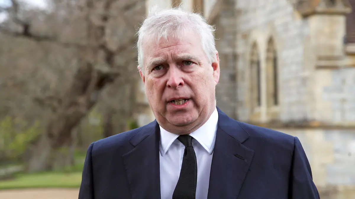 FILE PHOTO: Britain's Prince Andrew speaks to the media during Sunday service at the Royal Chapel of All Saints at Windsor Great Park, Britain following Friday's death of his father Prince Philip at age 99, April 11, 2021. Steve Parsons/PA Wire/Pool via REUTERS/File Photo