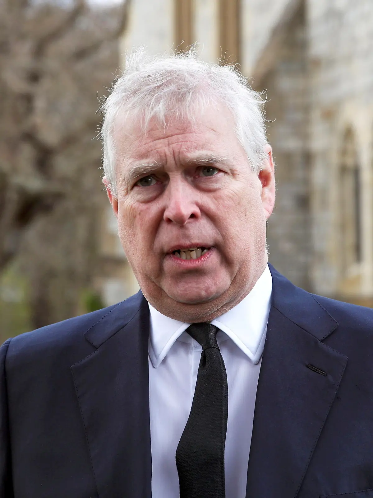FILE PHOTO: Britain's Prince Andrew speaks to the media during Sunday service at the Royal Chapel of All Saints at Windsor Great Park, Britain following Friday's death of his father Prince Philip at age 99, April 11, 2021. Steve Parsons/PA Wire/Pool via REUTERS/File Photo