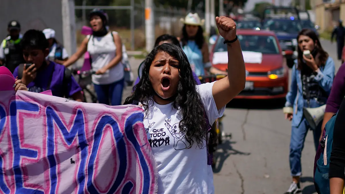 FILE - Roxana Ruiz shouts slogans during a march in memory of Diana Velazquez, who was making a call outside her home in 2017 when she was disappeared, raped and killed, in Chimalhuacan, State of Mexico, Mexico, July 2, 2022. Ruiz, who killed a man defending herself when he attacked and raped her in 2021 was sentenced to more than six years in prison, a decision her legal defense called “discriminatory” and vowed to appeal Tuesday, May 16, 2023.(AP Photo/Eduardo Verdugo, File)