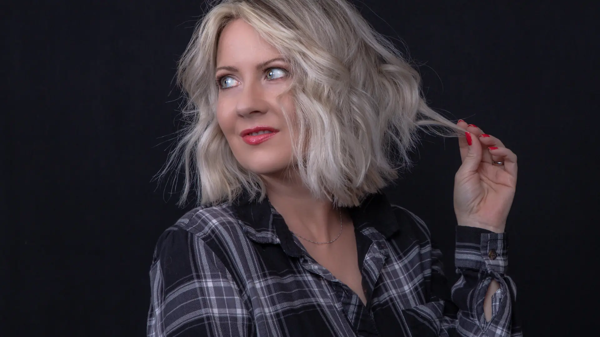 Woman With Platinum Blunt Shoulder Length Bob Hairstyle