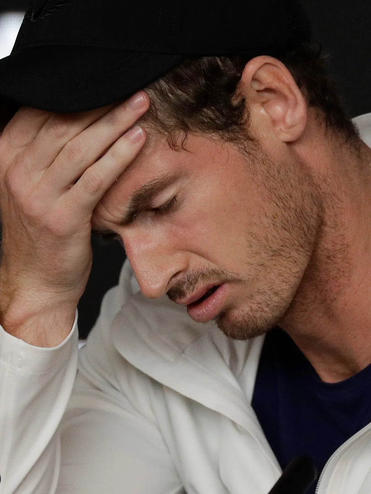 FILE - In this Tuesday, Jan. 15, 2019 file photo Britain's Andy Murray reacts during a press conference following his first round loss to Spain's Roberto Bautista Agut at the Australian Open tennis championships in Melbourne, Australia. Former world number one Murray's participation at the upcoming Australian Open is in doubt after the Briton tested positive for COVID-19. (AP Photo/Kin Cheung, File)