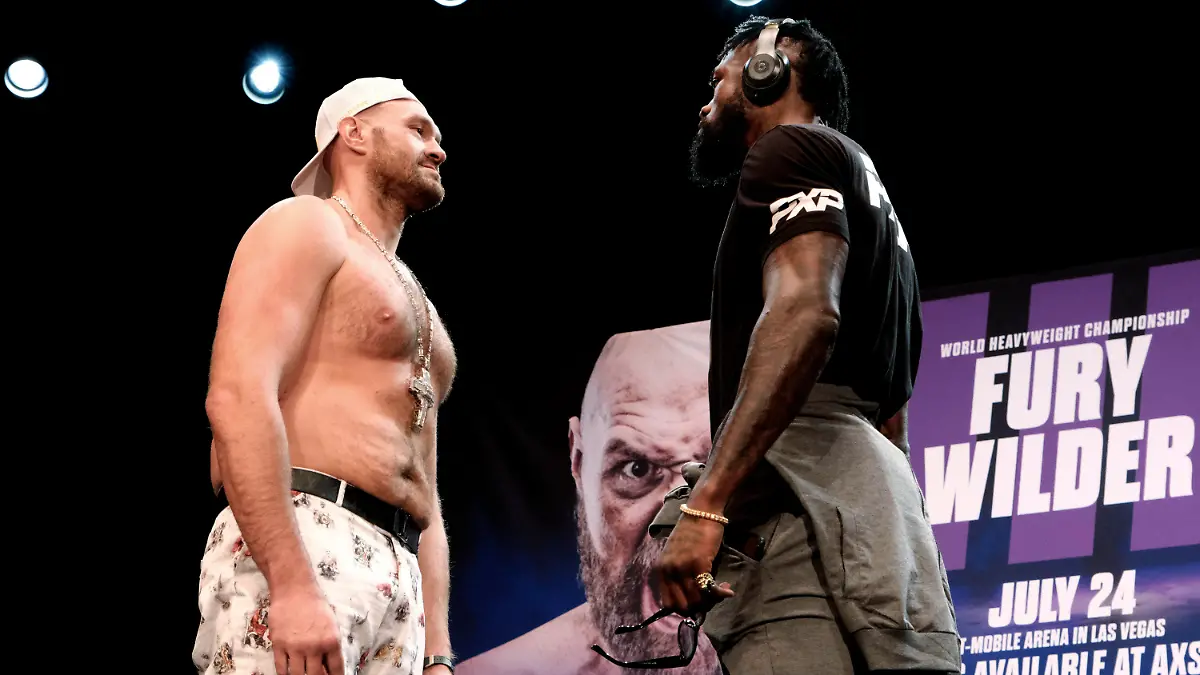 Tyson Fury, left and Deontay Wilder face off at a news conference in Los Angeles on Tuesday, June 15, 2021. The two are scheduled to fight in a heavyweight boxing bout July 24 in Las Vegas. (AP Photo/Richard Vogel)