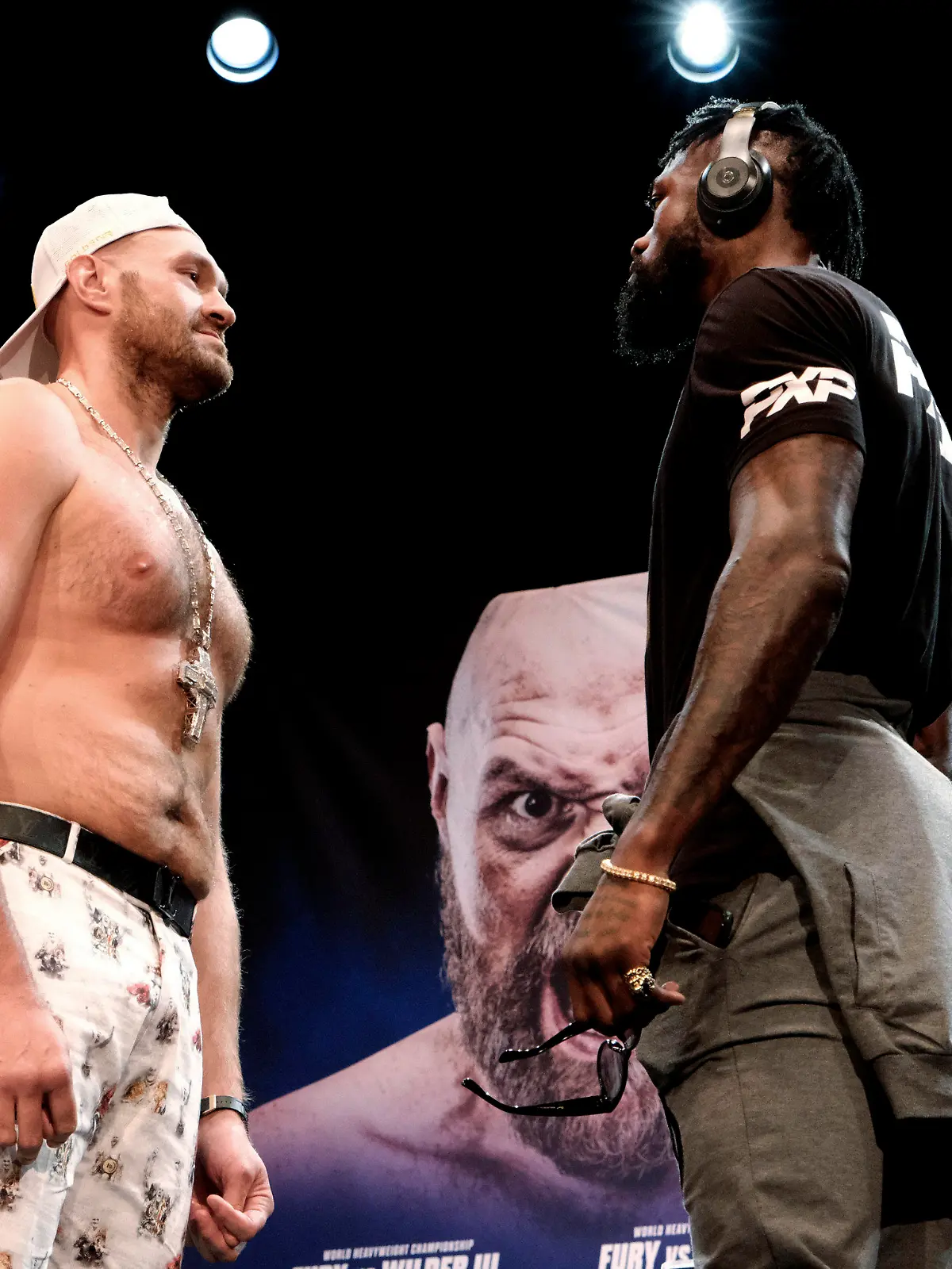 Tyson Fury, left and Deontay Wilder face off at a news conference in Los Angeles on Tuesday, June 15, 2021. The two are scheduled to fight in a heavyweight boxing bout July 24 in Las Vegas. (AP Photo/Richard Vogel)