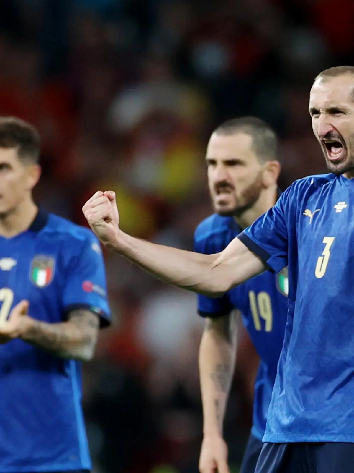 Soccer Football - Euro 2020 - Semi Final - Italy v Spain - Wembley Stadium, London, Britain - July 6, 2021 Italy's Leonardo Bonucci and Giorgio Chiellini react during the penalty shoot-out Pool via REUTERS/Carl Recine