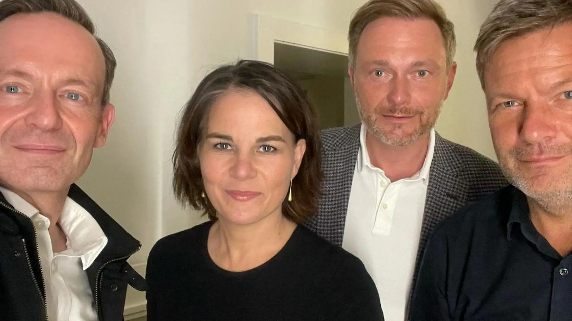 German politicians Volker Wissing and Christian Lindner of the FDP, together with Annalena Baerbock and Robert Habeck of the Greens, pose for a selfie photograph, in an unknown location September 28, 2021 in this picture obtained from social media. INSTAGRAM @volkerwissing /via REUTERS THIS IMAGE HAS BEEN SUPPLIED BY A THIRD PARTY. MANDATORY CREDIT. NO RESALES. NO ARCHIVES.