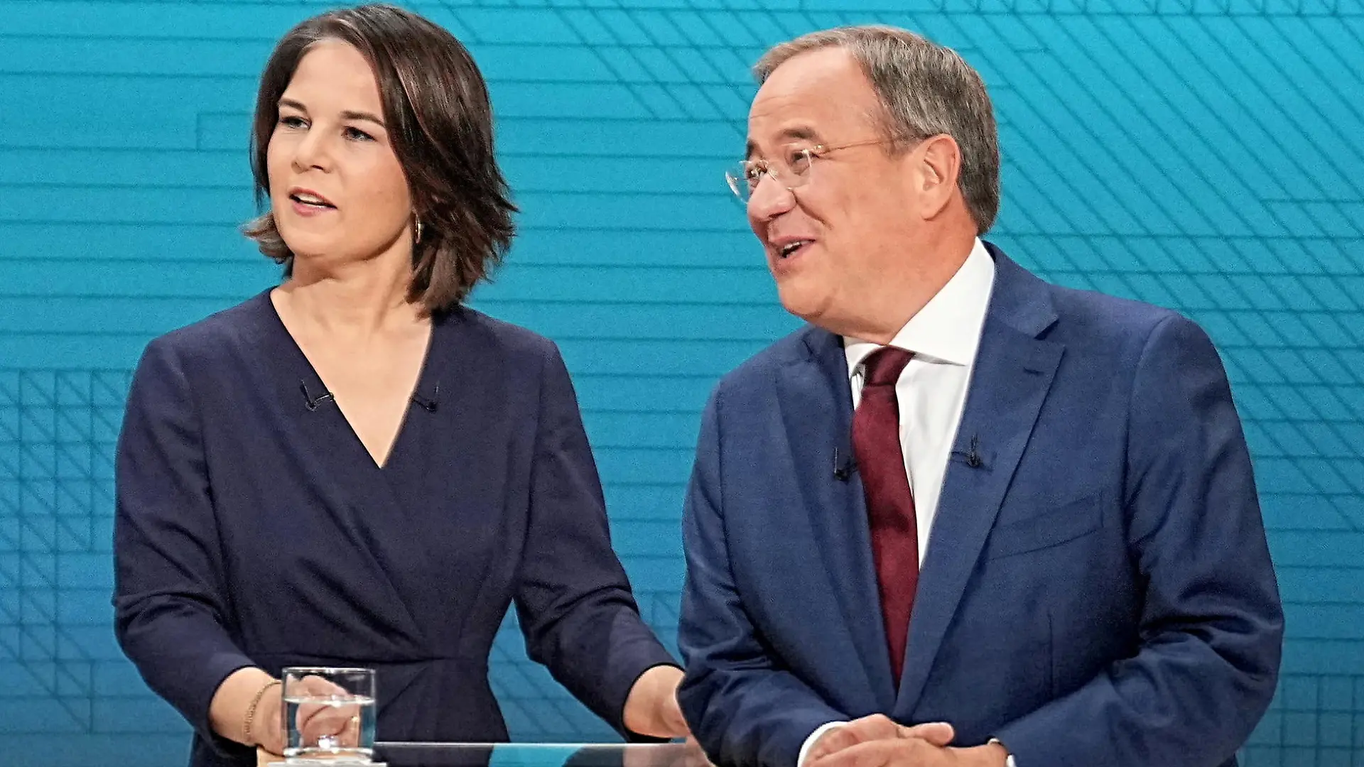 FILE PHOTO: Chairwoman of Buendnis 90/Die Gruenen Annalena Baerbock, Prime Minister of North Rhine-Westphalia (NRW) and leader of the Christian Democratic Union (CDU) Armin Laschet and German Finance Minister and Social Democratic Party candidate Olaf Scholz are pictured before a televised debate of the candidates to succeed Angela Merkel as German chancellor in Berlin, Germany, September 12, 2021. Michael Kappeler/Pool via REUTERS/File Photo