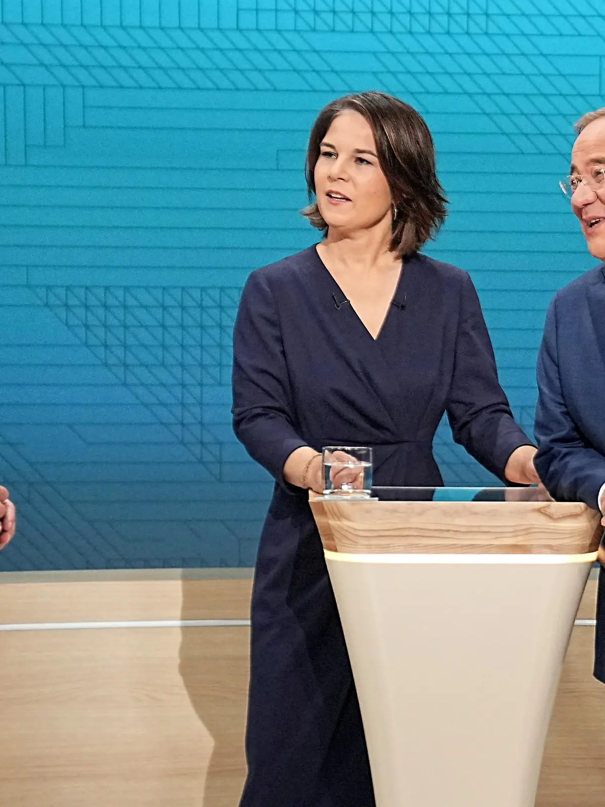 FILE PHOTO: Chairwoman of Buendnis 90/Die Gruenen Annalena Baerbock, Prime Minister of North Rhine-Westphalia (NRW) and leader of the Christian Democratic Union (CDU) Armin Laschet and German Finance Minister and Social Democratic Party candidate Olaf Scholz are pictured before a televised debate of the candidates to succeed Angela Merkel as German chancellor in Berlin, Germany, September 12, 2021. Michael Kappeler/Pool via REUTERS/File Photo