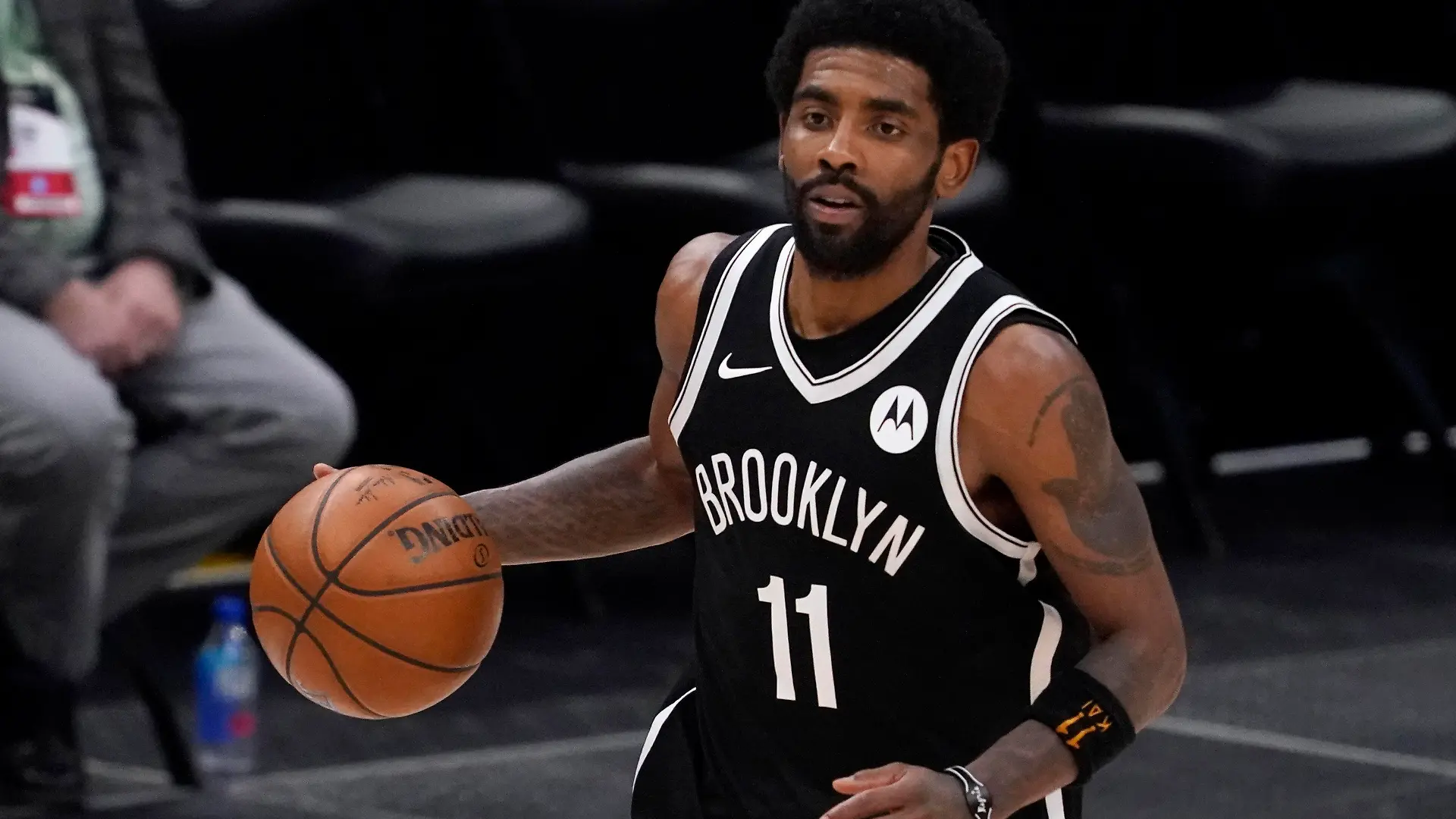 FILE - Brooklyn Nets guard Kyrie Irving handles the ball during an NBA basketball game against the Dallas Mavericks in Dallas, in this Thursday, May 6, 2021, file photo. Unable to attend the Brooklyn Nets' media day, Kyrie Irving asked for privacy Monday when pressed about his vaccination status and availability for home games. (AP Photo/Tony Gutierrez)