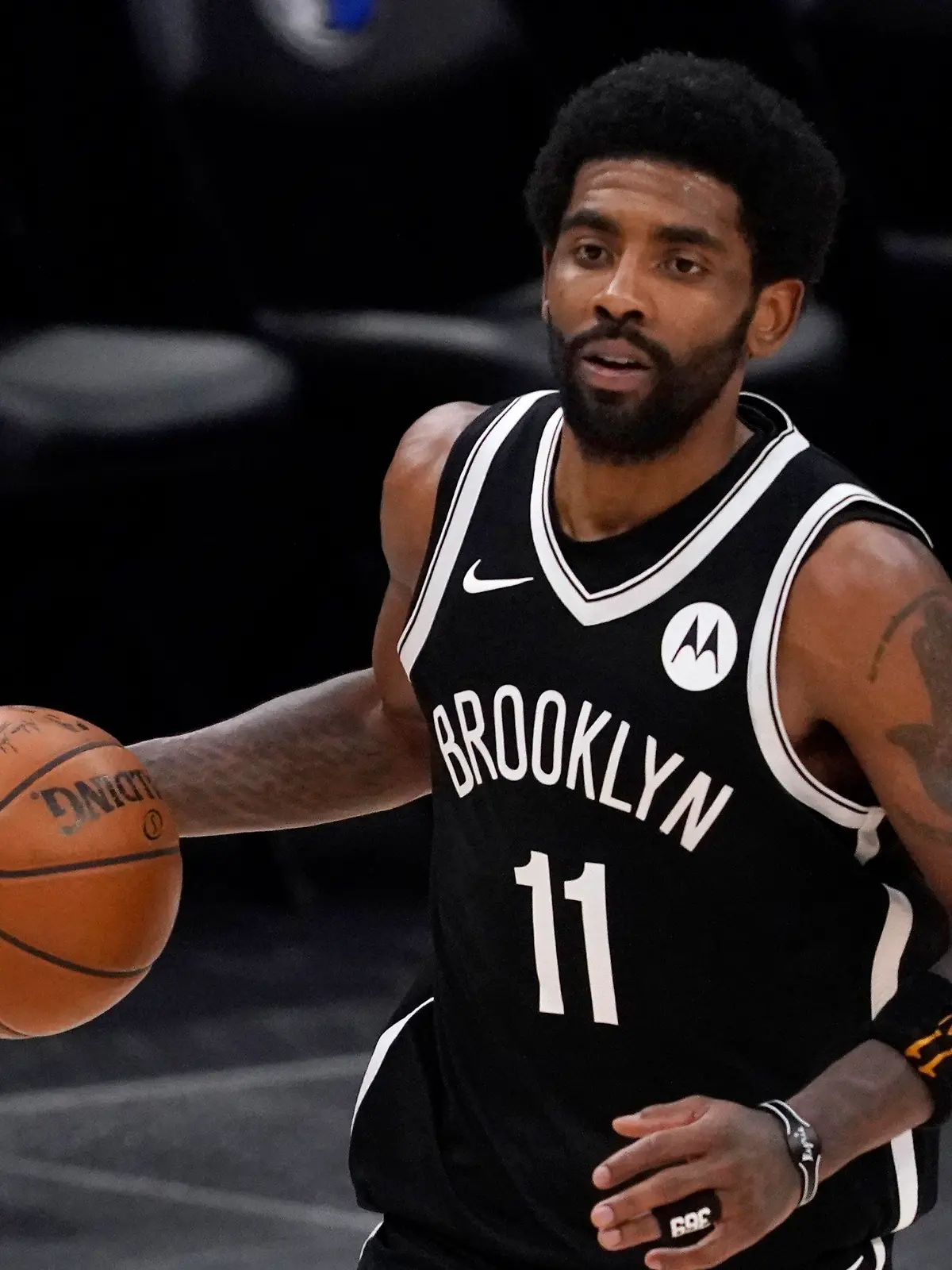 FILE - Brooklyn Nets guard Kyrie Irving handles the ball during an NBA basketball game against the Dallas Mavericks in Dallas, in this Thursday, May 6, 2021, file photo. Unable to attend the Brooklyn Nets' media day, Kyrie Irving asked for privacy Monday when pressed about his vaccination status and availability for home games. (AP Photo/Tony Gutierrez)