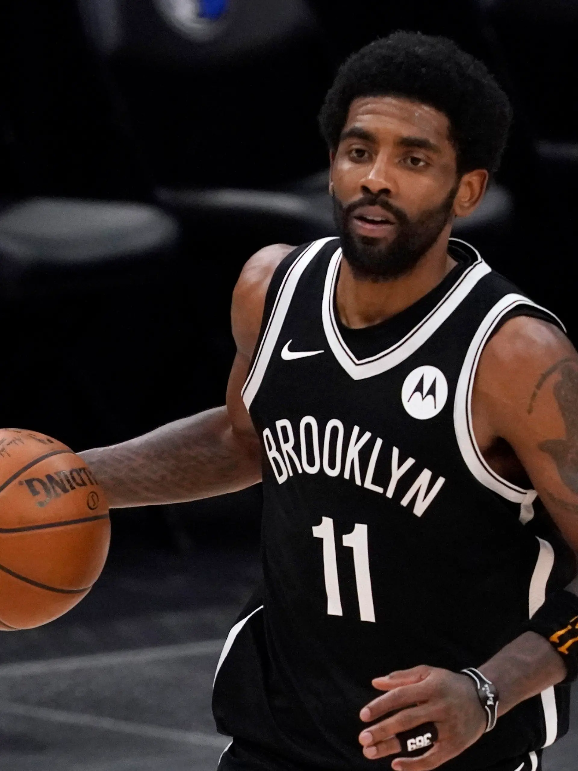 FILE - Brooklyn Nets guard Kyrie Irving handles the ball during an NBA basketball game against the Dallas Mavericks in Dallas, in this Thursday, May 6, 2021, file photo. Unable to attend the Brooklyn Nets' media day, Kyrie Irving asked for privacy Monday when pressed about his vaccination status and availability for home games. (AP Photo/Tony Gutierrez)