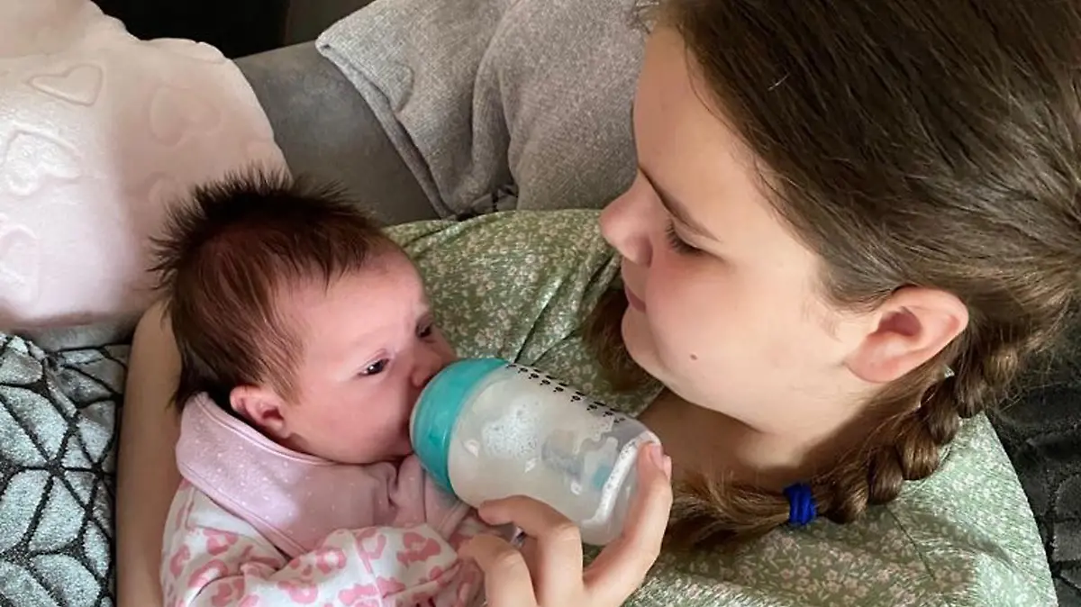 CATERS NEWS (PICTURED Jenni and Richard's youngest daughter Scarlett feeding her Niece) Could this be the UK's youngest grandparents? This couple welcomed their first grandchild when they were 33 and 35 years old. Jenni Medlam, now 34, from Hull, and her husband Richard, 35, became grandparents for the first time in their early thirties after the arrival of baby Isla-May in June. After giving birth to her first daughter at the age of 17, Jenni says that she was able to navigate and support her daughter, Charmaine, 16 when she told her that she was pregnant. Jenni and Richard are loving being young grandparents and say that strangers often think that Isla is their baby. SEE CATERS COPY.