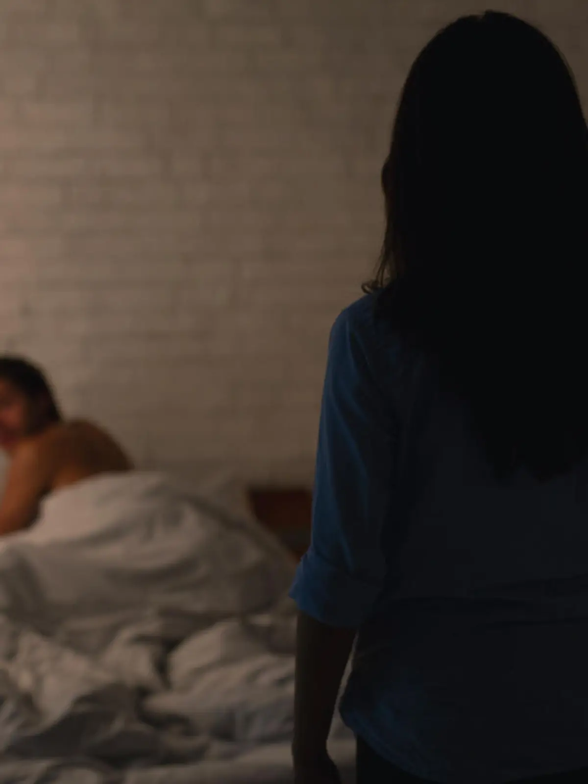 Infidelity Concept. Woman Catching Cheating Boyfriend Making Love With Another Girl In Their Bedroom At Home. Low Light